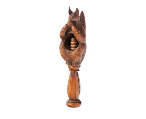 19th century fruitwood screw-action novelty nut cracker in the form of a squirrel, 17cm tall.  Good condition, working action