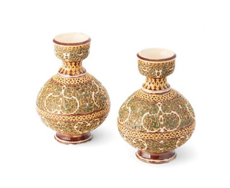 Zsolnay Pecs: a pair of reticulated pedestal vases, ornate pierced decoration, predominantly decorated in green, gilt highlig