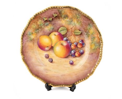 Royal Worcester cabinet plate, shaped edge, decorated with hand painted fruit, signed by D Shinnie, 27.5cm diameter.  In good