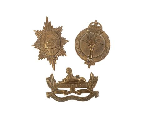 Set of three WW2 British Army helmet plate badges including Gloucestershire Regiment, Worcestershire Regiment and Welsh Guard