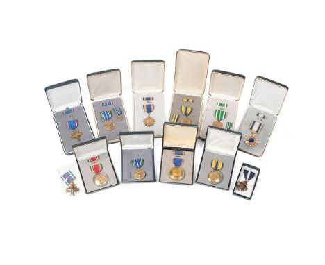 A collection of vintage cased American Military Service Medals to include 'Distinguished Service Cross', 'Air Force Commendat