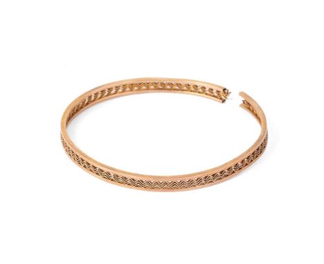 9ct gold bangle, ornate decoration, split, 10.0g.