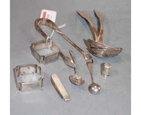 A pair of 19th century silver sauce ladles, in the Fiddle pattern; together with a pair of George V silver engine turned napk