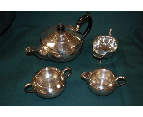 A mid-20th century silver sauceboat, having a shaped rim, on three padfeet, 3.5oz; together with a mid-20th century silver pl