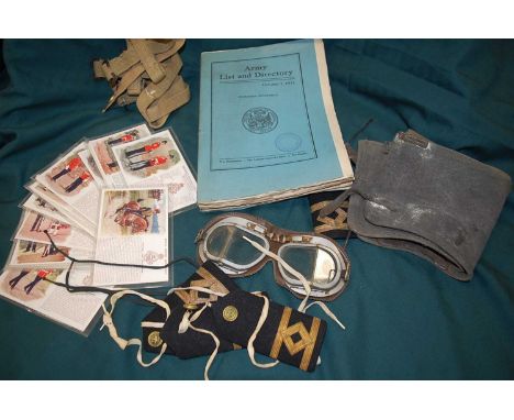 A collection of miscellaneous items, to include a pair of WWII RAF flying goggles (lacking elastic strap), various webbing st