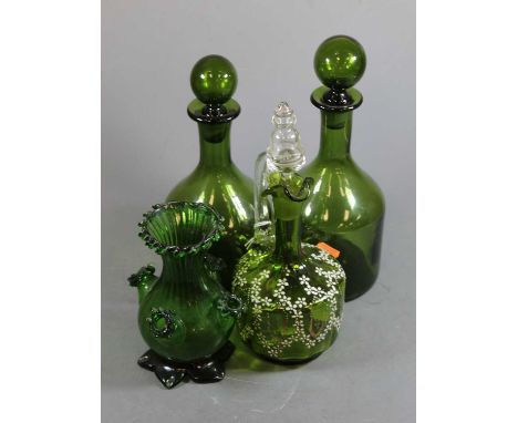 A pair of green glass decanters and stoppers of mallet shape, hieght 30cm, together with one other Victorian green glass liqu