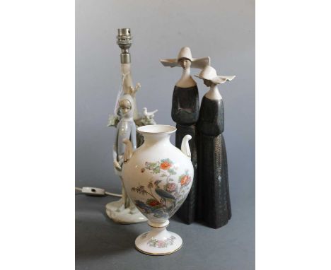 A large Lladro figure group of two nuns in standing pose with arms crossed, having printed Lladro mark verso, matt finish, he