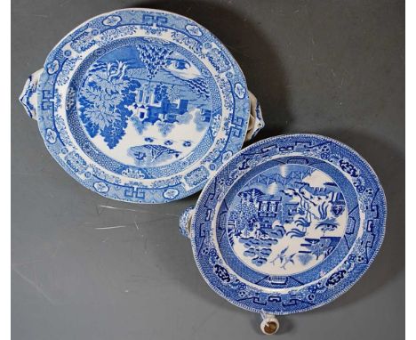 A 19th century Staffordshire warming plate, blue &amp; white transfer decorated in the Willow pattern, having twin handles an