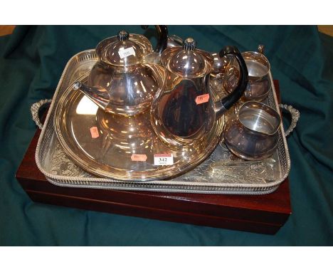 An Elkington silver plated four-piece tea and coffee service, designed by Eric Clements; together with a mahogany eight-place