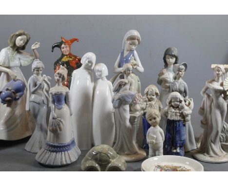 A collection of various porcelain figures to include Nao examples