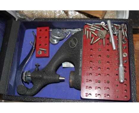 A box of assorted clockmakers tools and components, to include oak fitted box of various specialist screws, clamps, flat push