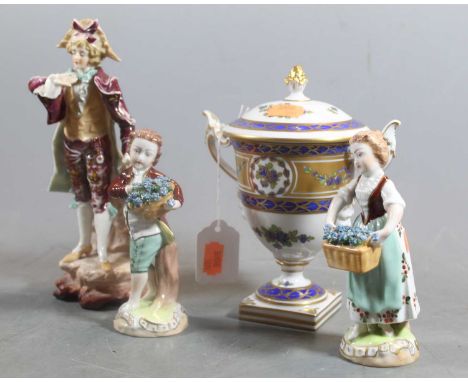 Four continental porcelain figures, comprising two figures of flower sellers, both marked Dresden verso, h.14cm; an urn marke