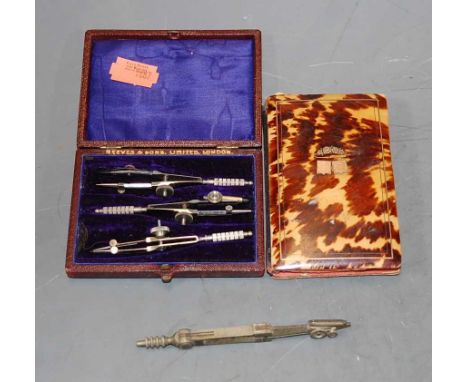 A Victorian tortoiseshell and yellow metal inlaid lady's aide-memoire; together with a leather cased set of three draughtsman