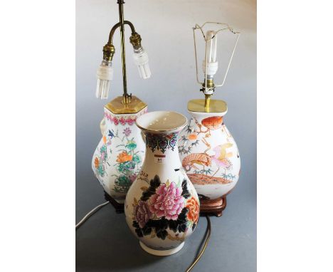 A modern ceramic table lamp in the Chinese style, of octagonal baluster form, enamel decorated with birds and flowers having 