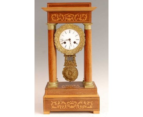 A late 19th century French rosewood and marquetry inlaid portico clock, the unsigned white enamel dial within chased gilt met