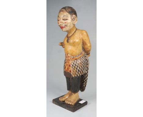 Figur "Der Beschneider", Bali/IndonesienBalsaholz, polychrom bemalt, auf rechteckiger Holzplinthe montiert. Sorgfältig modell