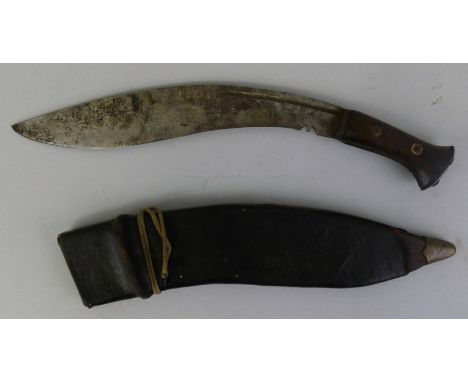 A WWII kukri, with wood grip, leather scabbard stamped 1941, with the broad WD arrow, 51cm long.