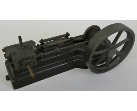 A model horizontal beam live steam double piston engine, mounted on a cast iron plinth, 20cm.