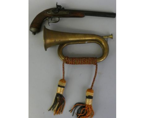 A reproduction percussion cap pistol, together with a brass military type bugle.