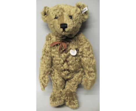 A Steiff Limited Edition hot water bottle teddy bear, with brass coloured mohair, the laced up front opening to reveal a remo