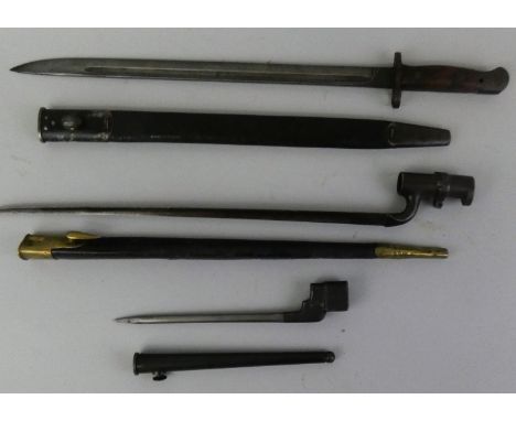 A Lee Enfield bayonet with scabbard, GR proof mark, another with WD proof mark and a third stamped No 4 Mk II and two brass s