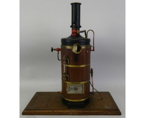 A vertical live steam boiler, with pressure gauge and thermometer, mounted on a plinth, height 48cm, applied plague J.M. Prou