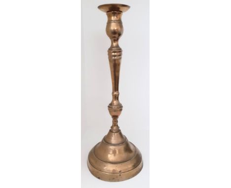 A 19th century Ottoman Turkish brass candlestick,impressed mark to top, H.42cm