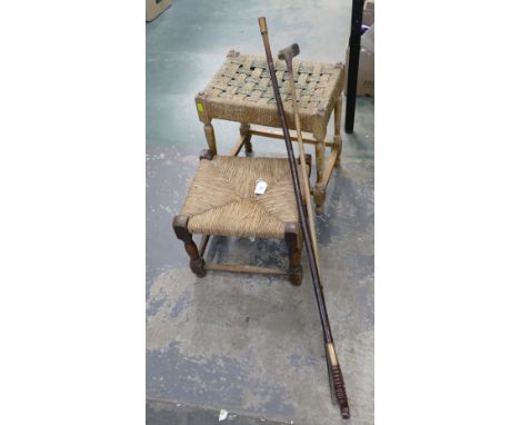 Two woven top footstools, vintage golf club and walking stick