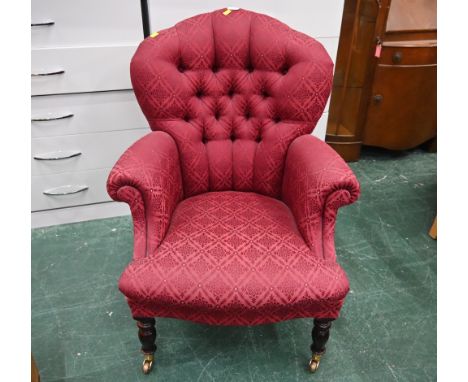 Reproduction deep red patterned button back armchair on castors