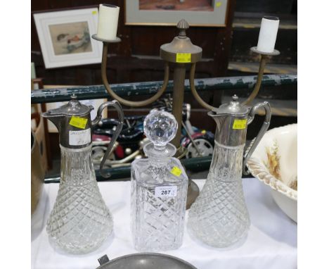 Two metal topped claret jugs, decanter and brass lamp base