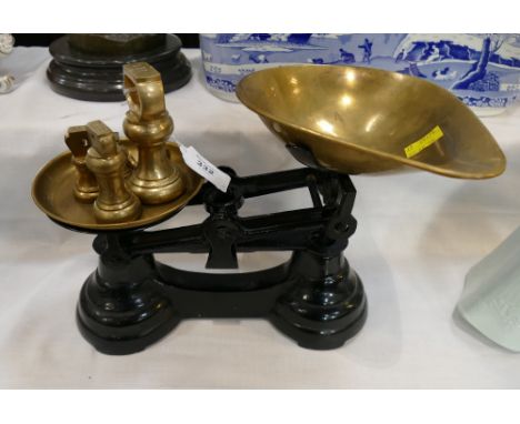 Traditional metal scales with brass weights