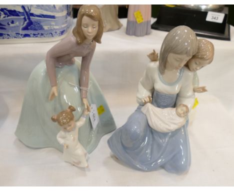 Two Nao figurines, mothers and children