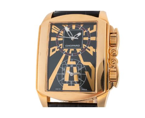 A CHOPARD DUAL TIME ZONE 18CT GOLD REF 2286 WATCHWith signed double dial with Arabic hour markers, with dual crown and hinged