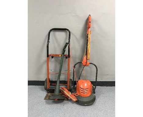 A box of sash clamps, power tools, sprit levels, sack barrow, mower and a strimmer 
