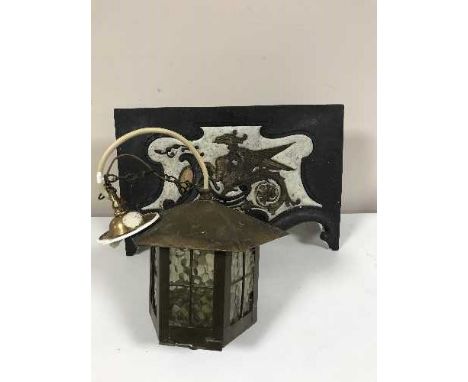 A brass three way light fitting, carriage lamp and ornate fire front 