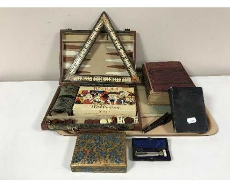 A tray of boxed games compendium, cribbage board, books, papier mache box, leather work tool etc 