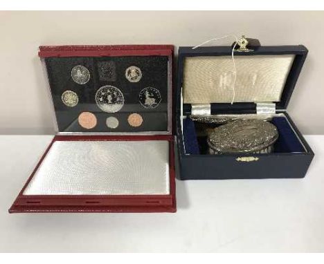 A boxed silver comb and hand brush with a boxed Royal Mint 1993 proof coin set 