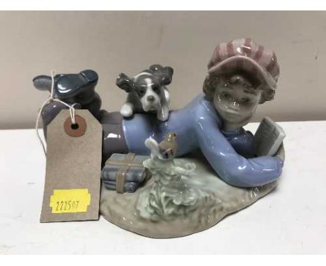 A Lladro figure - boy reading with puppy number 5451 
