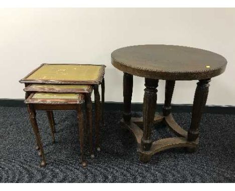 A circular oak lamp table and nest of three tables 