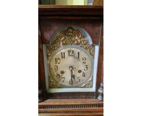 A mantel clock with silvered dial. Some photo's show it with additional top pediment fixed (was stored loose in case). All cl