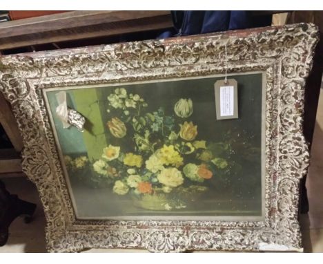 Elaborate wooden carved frame, French (currently housing a floral print), some losses frame measures 87 x 71 cm overall. Aper