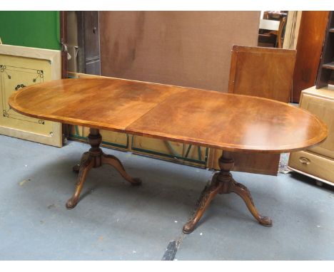 INLAID SECTIONAL MAHOGANY EXTENDING DINING TABLE WITH EXTRA LEAVES, ON TWO CARVED TRIPOD SUPPORTS