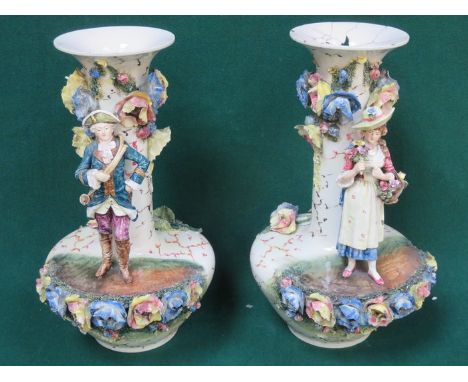 PAIR OF LARGE RELIEF DECORATED CERAMIC VASES (AT FAULT) 