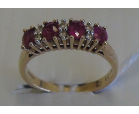 A Diamond and Ruby Eternity Ring. Size N.