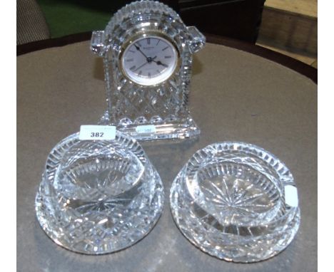 A Large Waterford Crystal Mantle Clock, along with two ashtrays.