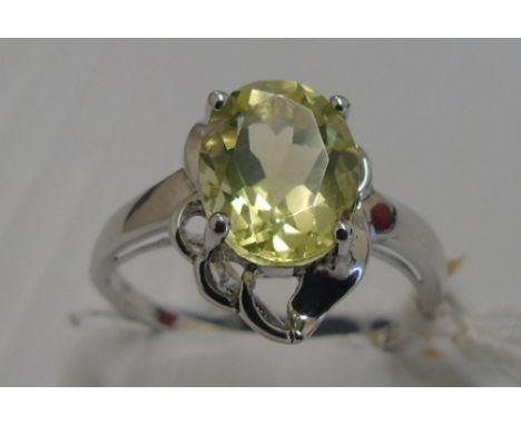 A Silver Ladies Yellow Gem Set Ring. Size K 1/2.