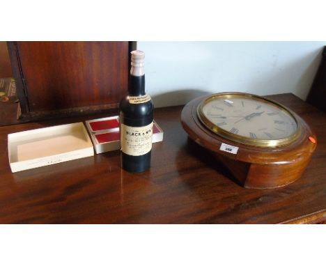 A Smith of London Wall Clock, along with a Vintage Musical Black and White Whisky Cigarette Dispenser in Bottle Form with lig