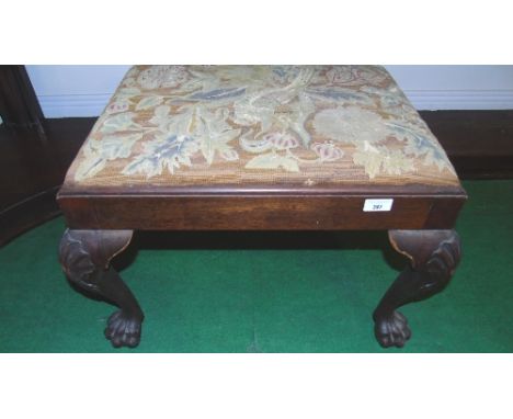 An Early 19th Century Irish Footstool, having its original tapestry drop in seat standing on shell carved cabriole legs and p