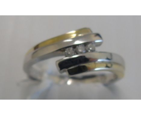 A Nine Carat Diamond Three Stone Ring. Size K 1/2.