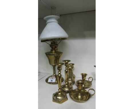 An Attractive Brass Oil Lamp, with chimney & white glass shade along with three sets of brass candlesticks.